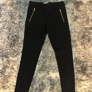 Stylish black leggings with gold zipper detail